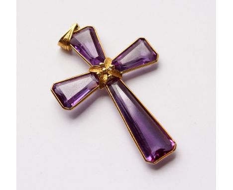 AN 18CT GOLD AND AMETHYST CROSS. 2.25ins long.