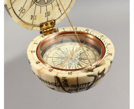 A GOOD ETCHED BONE BALL COMPASS. 2.5ins diameter.