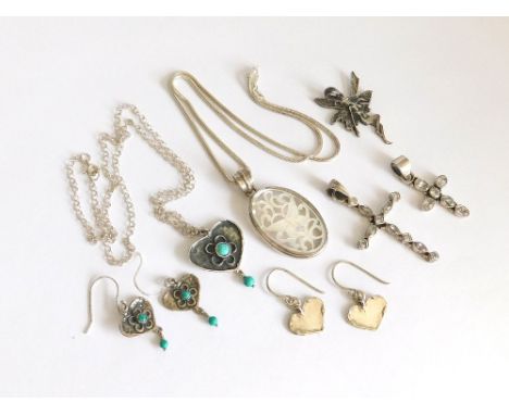 SILVER CROSSES ETC. Two stone set silver crosses & a carved mother of pearl & silver pendant & chain. Also, a turquoise set s