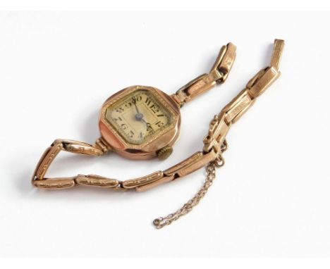 GOLD WATCH. A lady's Art Deco, 9ct. gold cased wristwatch, on 9ct. gold expanding strap (strap damaged). Gross weight approx.