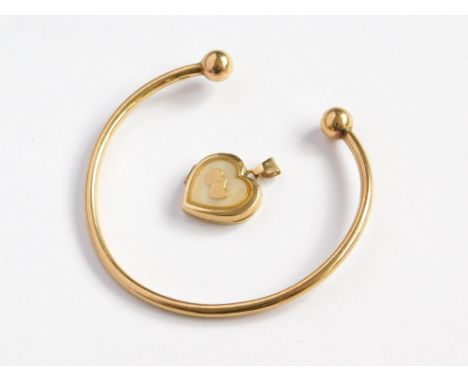 GOLD BANGLE ETC. A 9ct. gold torque bangle & a modern 9ct. gold heart pendant. Approx. 8.1g. Please note that all items in th