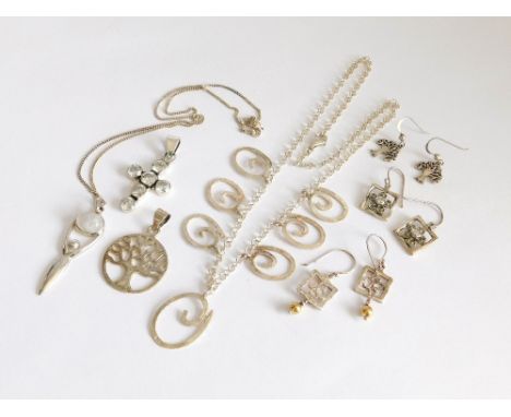 SILVER PENDANTS ETC. A Silver Tree of Life pendant with matching earrings, two other pairs of earrings, a stone set cross etc