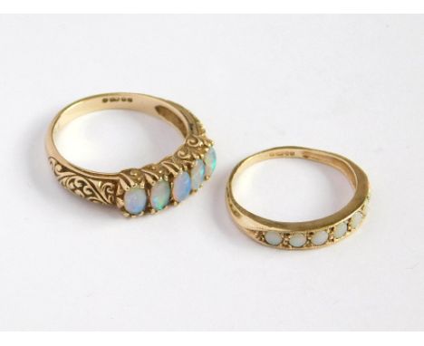 OPAL RINGS. A 9ct. gold, Victorian style, five stone opal ring, with open back setting. Size Q. Also, one other 9ct. gold, fi