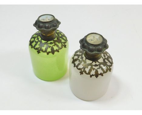 SCENT BOTTLES. A pair of 19th century gilt metal mounted, opaque glass scent bottles, each lid inset a print of a continental