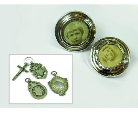 SILVER FRAMES ETC. A pair of early 20th century small silver mounted photograph frames, London 1919, diameter 6cm. (One with 