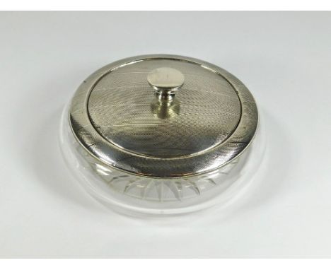 POWDER BOWL. A silver mounted, cut glass powder bowl with mirrored lid. Birmingham 1949. Diameter 13.5cm.Please note that all