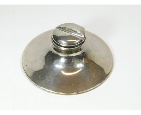 SILVER INKWELL. An Edwardian silver capstan inkwell, the lid incorporating a pen rest. Birmingham 1905.Please note that all i