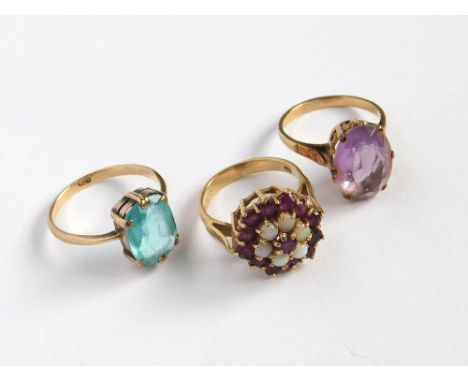 GOLD RINGS. Three 9ct. gold dress rings including a ruby & opal cluster etc. Gross weight approx. 11.3g. Please note that all