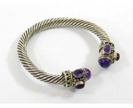 AMETHYST BANGLE. An amethyst & silver torque bangle, possibly Indian. Please note that all items in this auction are previous