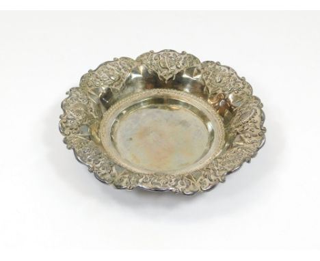 GERMAN SILVER. A German 800 Standard silver dish with repousse border. Diameter 15cm.Please note that all items in this aucti