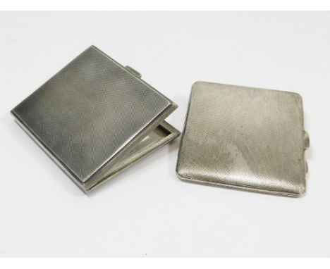 CIGARETTE CASES. Two engine turned silver cigarette cases.Please note that all items in this auction are previously owned & a