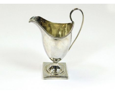 CREAM JUG. A George III silver cream jug with beaded decoration. London 1793.Please note that all items in this auction are p