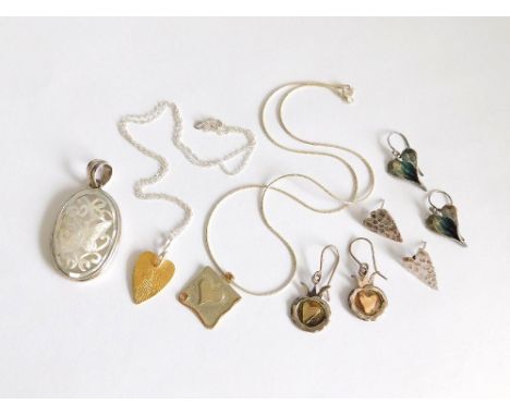 SILVER PENDANTS ETC. Three silver pendants including a carved butterfly in mother of pearl & silver. Also, three pairs of hea