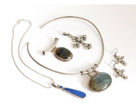 SILVER PENDANTS ETC. Three silver pendants. A torque hung with labradorite; a silver mounted lapis with chain; & a hinged sil