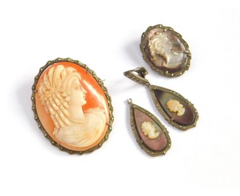 CAMEOS. A shell carved cameo in 800 standard silver & marcasite brooch mount. Also, one other shell carved cameo with matchin