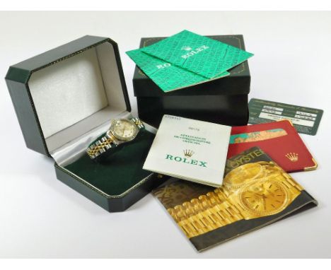 ROLEX. A lady's Rolex, 18ct. gold & steel cased Rolex Oyster Perpetual Datejust wristwatch. The mother of pearl dial with dia
