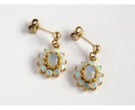 OPAL EARRINGS. A pair of 9ct. gold mounted, opal cluster stud earrings. Length of drop 1.8cm. Please note that all items in t