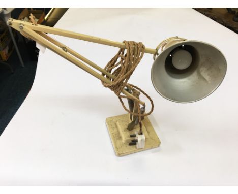 A cream finished Anglepoise desk lamp.