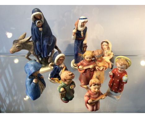 Nine Goebel figurines including Virgin and Child on donkey, angels with instruments, etc.