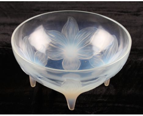 A Rene Lalique opalescent glass bowl in Lys pattern, no. 383, having four relief moulded flowerhead design and feet, bears mo