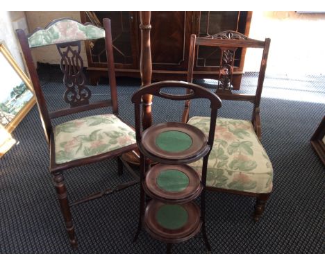 An Edwardian nursing chair with an Edwardian bedroom chair, an oak lamp and a mahogany cake stand.