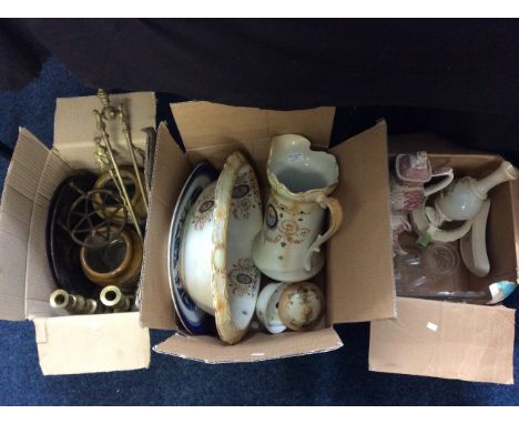 Three boxes of mixed items including ceramic wash basin and jug, a brass companion set, candlesticks, a pair of vases etc.