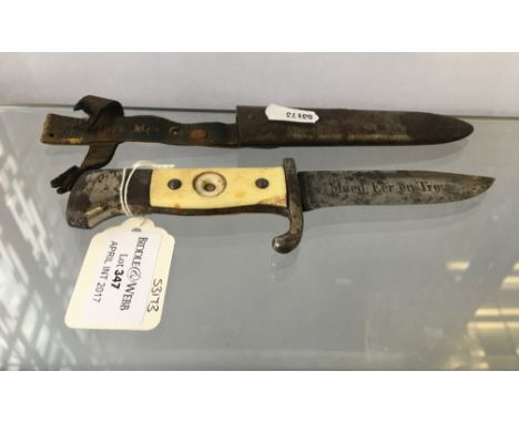 A Dutch Hitler Youth knife and sheath, blade marked 'Moed, Eer en Tronw' and stamped Eickhorn Solingen, handle missing enamel