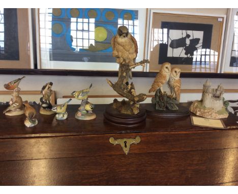 A collection of onrnaments including five Royal Worcester bird figurines, One Royal Doulton and one Sherratt and Simpson moun