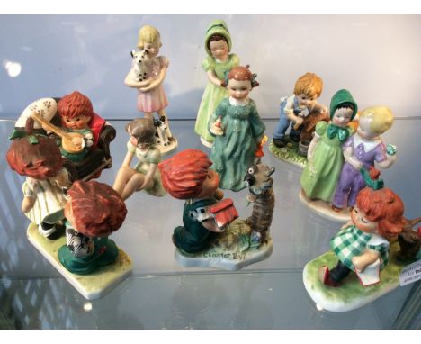 Nine Goebel figurines including girl with dogs, children painting house, boy with mandolin etc.