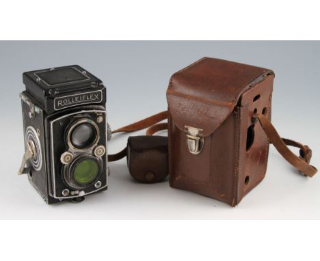 An early Rolleiflex TLR camera in leather case, numbered 1007803.