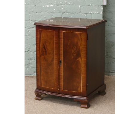 A mahogany bow front hifi cabinet raised on ogee bracket feet.