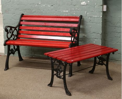 A Victorian style painted garden bench and table.