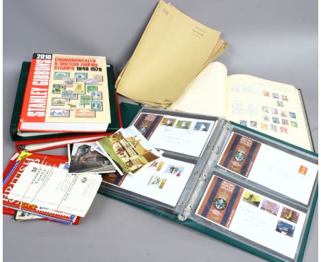 A quantity of stamp and first day cover albums along with empty albums and Stanley Gibbons 2010 catalogue.