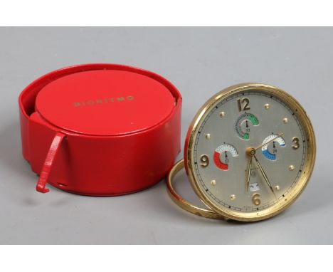 A cased brass Bioritmo desk top multi dial alarm clock with date display.