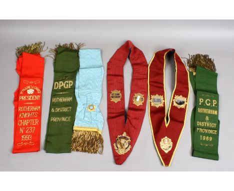 Buffalos regalia including two collars with enamelled jewels and a quantity of sash with gold thread.