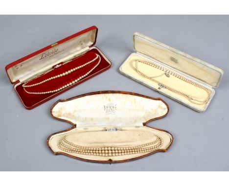 Three cased vintage simulated pearl necklaces including one with silver clasp.