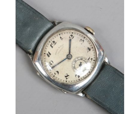 A boxed silver cased gentleman's manual wristwatch by Kendal & Dent with Arabic numeral marks and subsidiary seconds, assayed