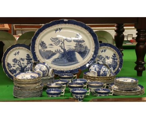 An extensive Booths 'real old willow' pattern tea/dinner service including meat plate, dinner plates, cups, saucers, side pla