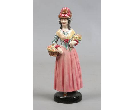 A Goldscheider figure of a flower seller.