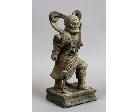 A Chinese carved wood small statue of a warrior with gesso decoration.