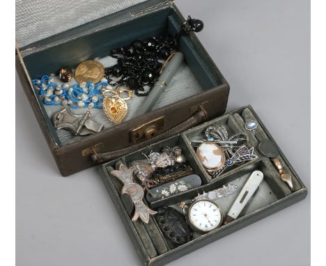 A vintage jewellery box and contents including pietra dura brooch, silver fob watch, mother of pearl knife, jet and marcasite