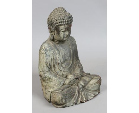 A Chinese carved wood small statue of a seated meditating Buddha.