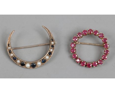 A 9ct gold sapphire and pearl crescent brooch and a 9ct gold ruby circlet brooch.