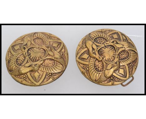 A vintage yellow metal cloak clip clasp with a celtic snake design. Measures 11cms x 5.5cms.