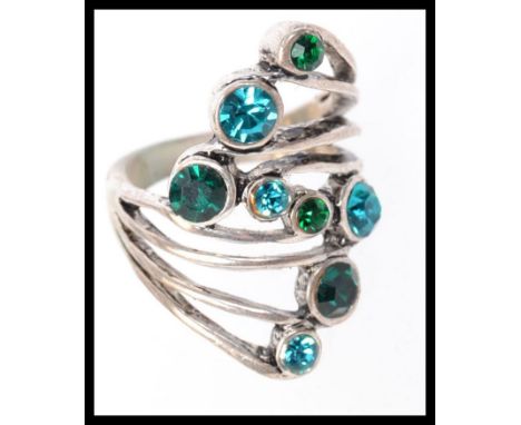 A 925 silver dress ring set with peacock rhinestones. Weight 12.3g. Size R.5.