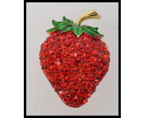 Large vintage strawberry brooch with vibrant pave set red rhinestones with green enamel leaves. Measures 2 inches. Weight 25g