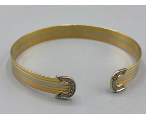 Well presented 18ct 3 tone diamond bangle (12.43g)