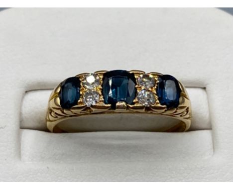 Ladies 18ct gold diamond and sapphire 7 stone ring. Size O (3.65g)