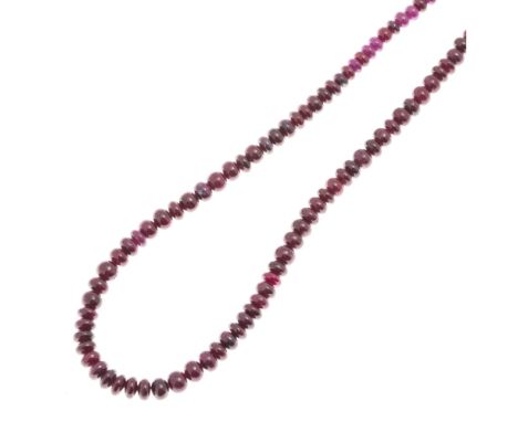 A ruby bead necklacecomposed of a single strand of polished, slightly graduated ruby beads, to a plain lobster type clasp, st