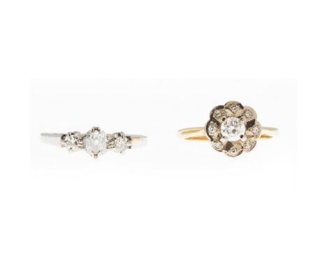 A diamond set cluster ringthe central round cut diamond in a single border of small eight cut diamonds, to a plain 18ct gold 